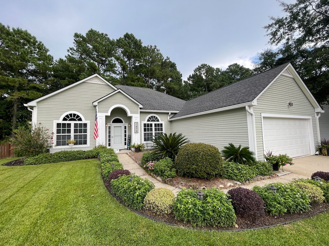 J&J Earthworks Transforms Dunes West Roofs with Expert Soft Washing Services